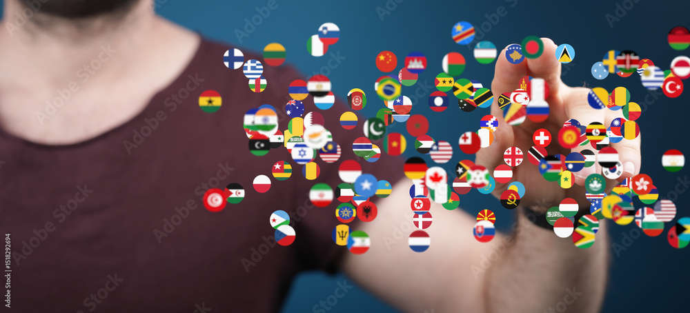 Poster A man interacts with a digital display of world flags, symbolizing global connection and networking.