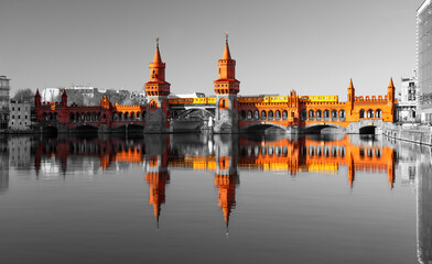 Oberbaum Bbridge“ in Berlin is a popular landmark and iconic sight spanning over River Spree with...