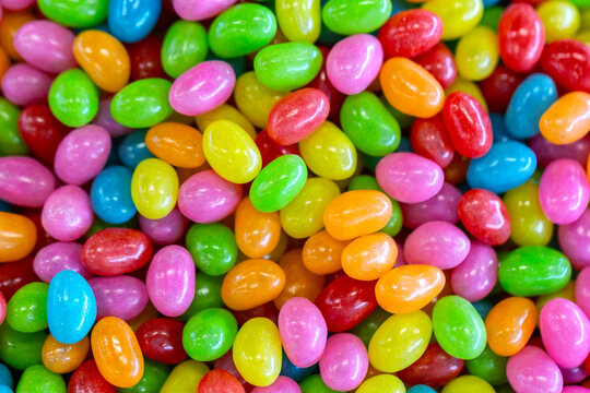 Jelly beans colorful background. Marmalade sweet candies close up macro food background