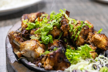 Delicious grilled chicken with fresh greens.