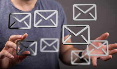 Person managing emails, online communication, inbox management concept.