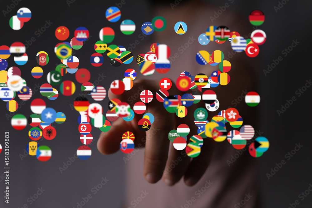 Poster abstract image of a hand interacting with numerous flags representing global connectivity.