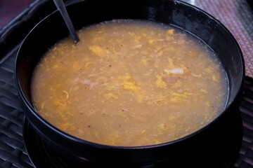 Chicken Corn Soup is an egg-drop soup that features shredded chicken, corn and a rich chicken stock base thickened with cornstarch slurry; Pakistani style.