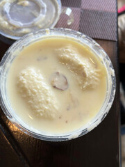 Rasmalai is a popular East Indian delicacy made with milk, a curdling agent, sugar, nuts, saffron and cardamoms.