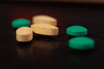 colorful medical pills on black background