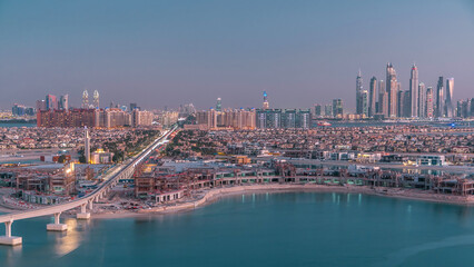 Naklejka premium Jumeirah Palm island skyline day to night timelapse in Dubai, UAE.