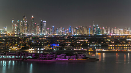 Jumeirah Palm island skyline night timelapse in Dubai, UAE.
