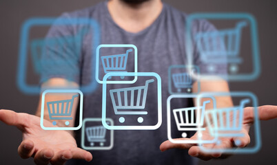 Person holding digital shopping carts, symbolizing online shopping, e-commerce, and digital...