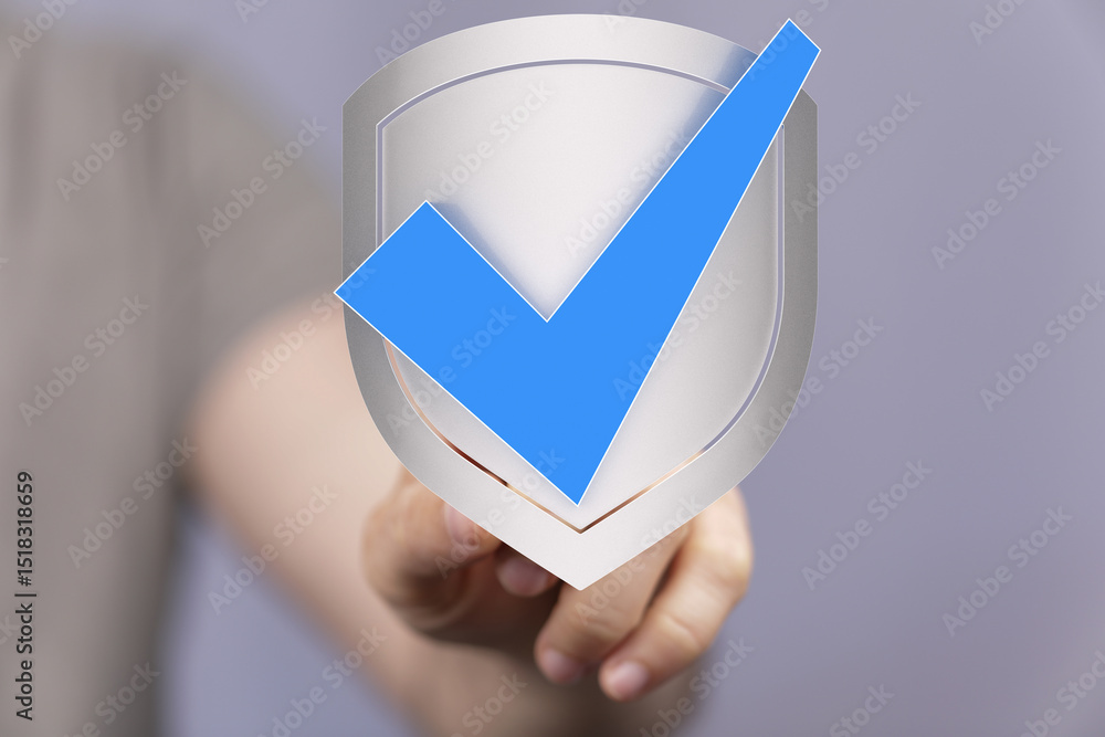 Poster hand holding a digital shield with a checkmark, symbolizing security and approval.