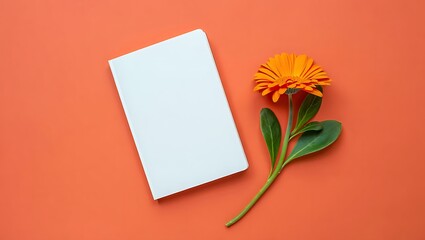 Blank Notebook and Orange Flower A Minimalist Still Life