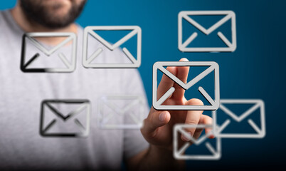 A person interacts with email icons, choosing one from many.  Concept of email management.