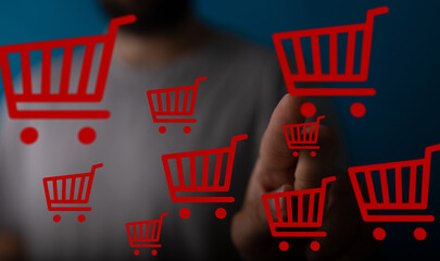 Image of a person interacting with virtual shopping carts, representing online shopping and...