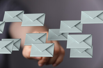 Person interacting with email messages, digital communication, inbox management.