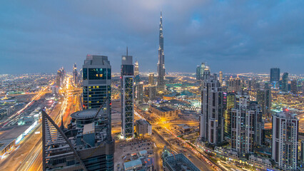 Obraz premium Panoramic skyline of Dubai day to night timelapse, United Arab Emirates. View of world famous skyscrapers.