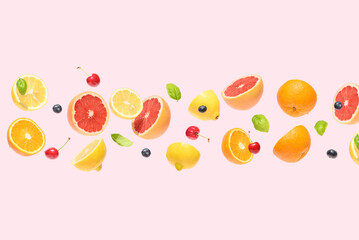 Visual Summer fruit on a pink background.