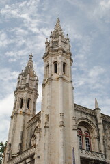 Fototapeta premium Low Angle View of Jeronimos Monastery Towers Against Cloudy Sky