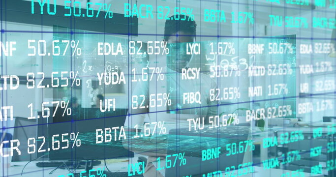 Image of data processing over african american businesswoman using laptop in office