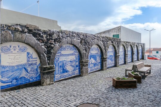 Historic Stone Wall With Traditional Azulejo Tile Murals In Velas, Sao Jorge. Portuguese art, architectural detail, urban landscape, cultural heritage, blue and white ceramics, for travel, cultural
