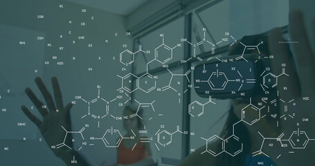 Image of chemical formula over caucasian woman using vr headset