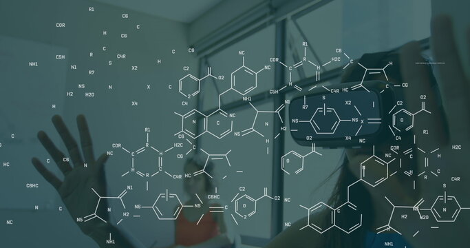 Image of chemical formula over caucasian woman using vr headset