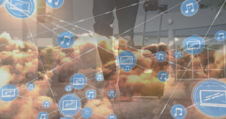 Image of network of connections over clouds and midsection of african american businessman