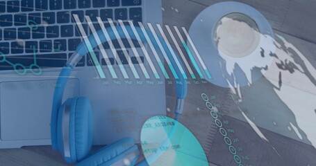 Image of financial graph over laptop on desk