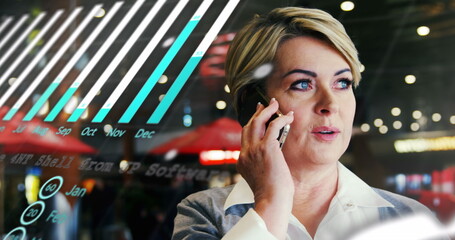 Image of graph, globe and data over happy caucasian woman using phone in city at night