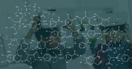 Image of chemical formulas over african american boy using vr headset