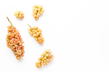 Many fresh green grape clusters isolated on white background.