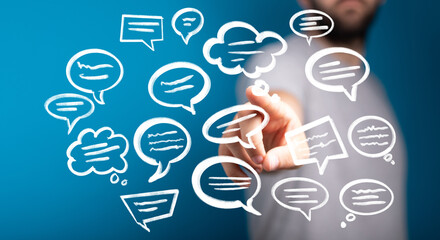 Image of a man interacting with speech bubbles, illustrating communication and ideas.