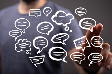 Image depicts a person interacting with floating speech bubbles, symbolizing communication, social...