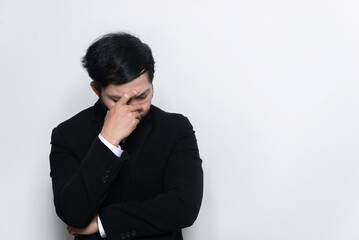Portrait of asian handsome businessman wear suit on white background,Stress man concept