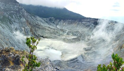 A stunning view of the crater of Mount Tangkuban Parahu, an active stratovolcano located in West...