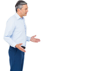 Mature adult man wearing business casual attire gesturing in studio with white backdrop, copy space