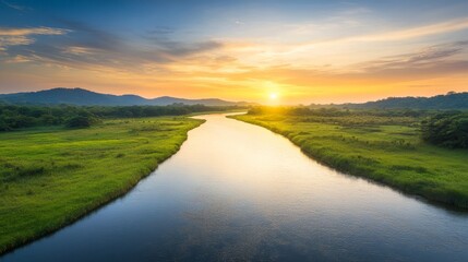 Tranquil River Landscape at Sunset with Lush Greenery and Mountains