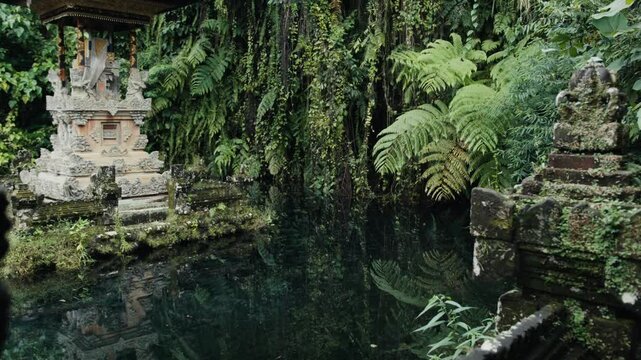 Gunung kawi sebatu temple reflecting in pond water in bali