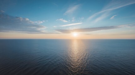 Fototapeta premium Breathtaking view of the sunset over the calm ocean waters