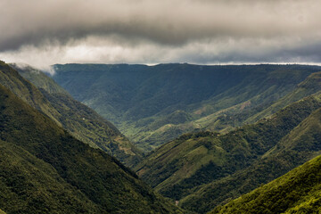 Meghalaya's majestic Mawkdok-Dympep Valley under a dramatic sky, showcasing the region's stunning natural beauty. 