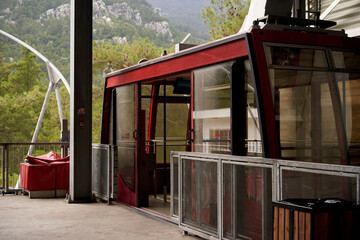 10.05.2019 Antalya, Mount Olympus Red cable car with mountain scenery at the station