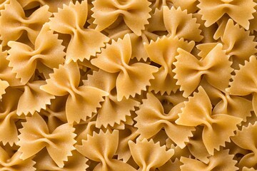 closeup of a pile of uncooked italian farfalle pasta