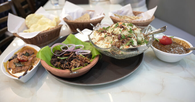 Authentic South Indian Meal with Biryani, Chicken Curry, Beef Fry, Beef Curry, Porotta, and Chapathi