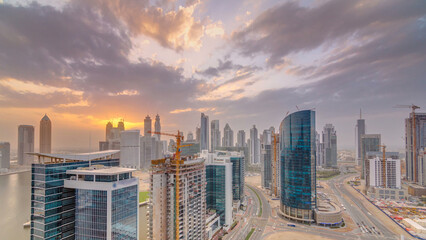 Obraz premium Dubai business bay towers at sunset aerial timelapse.
