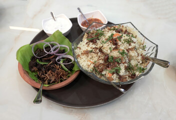 Authentic South Indian Meal with Biryani, Chicken Curry, Beef Fry, Beef Curry, Porotta, and Chapathi
