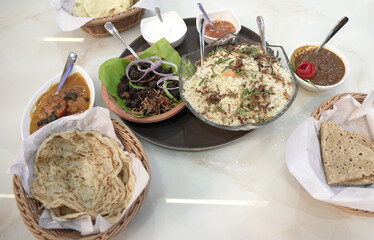 Authentic South Indian Meal with Biryani, Chicken Curry, Beef Fry, Beef Curry, Porotta, and Chapathi