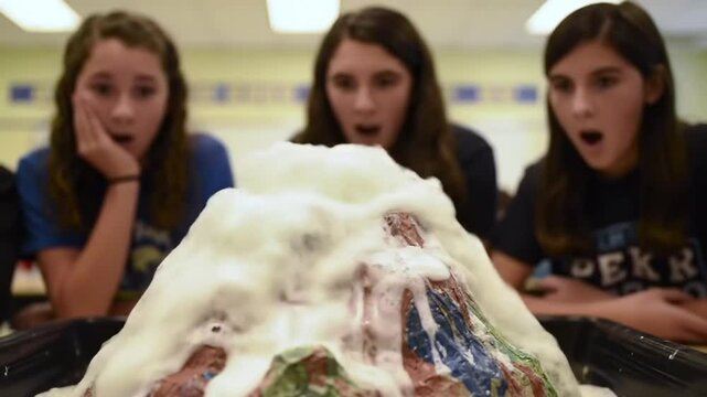 Exploding volcano science experiment in classroom 