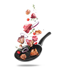 Raw and fried beef steaks with ingredients for cooking meat in a pan