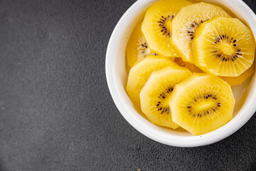 Kiwi yellow slices tasty fruit fresh delicious gourmet food background on table rustic food top view copy space keto and paleo diet vegan and vegetarian food