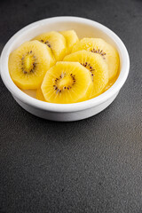 Kiwi yellow slices tasty fruit fresh delicious gourmet food background on table rustic food top view copy space keto and paleo diet vegan and vegetarian food