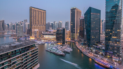 Obraz premium Beautiful aerial top view day to night transition timelapse of Dubai Marina canal