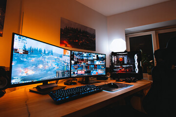 Naklejka premium professional gaming setup with multiple monitors displaying competitive match